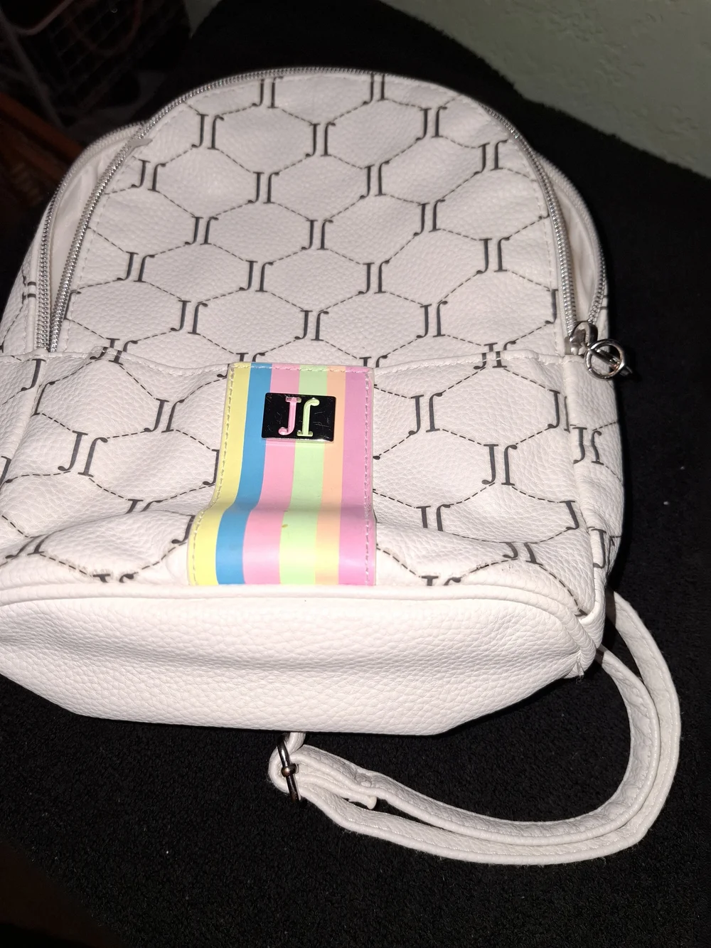 Justice mini backpack featuring an all-over 